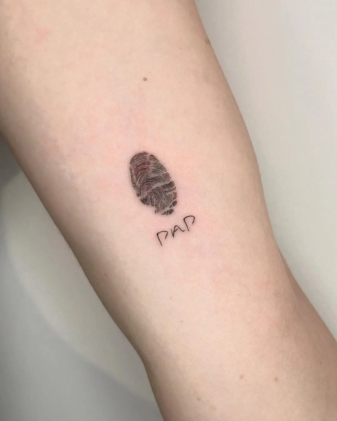 Unique fingerprint tattoo showcasing individuality