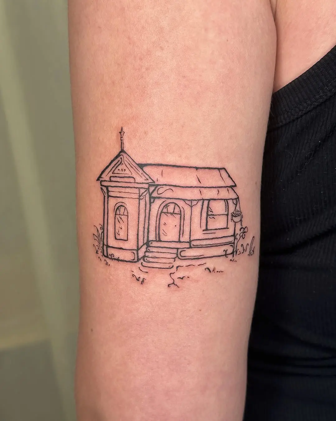 Minimalist house design tattoo on the arm