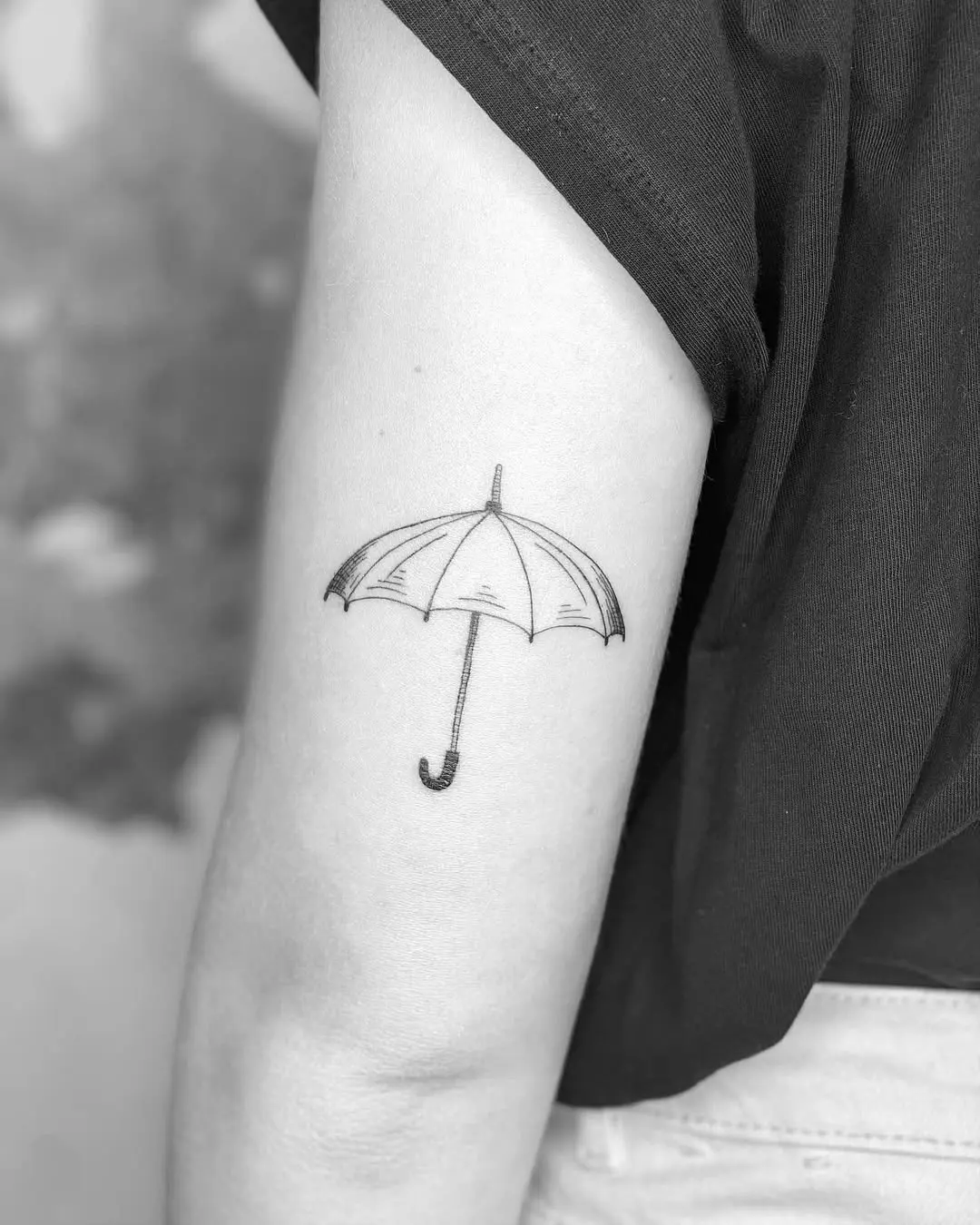 Elegant Minimalist Umbrella Tattoo on Arm