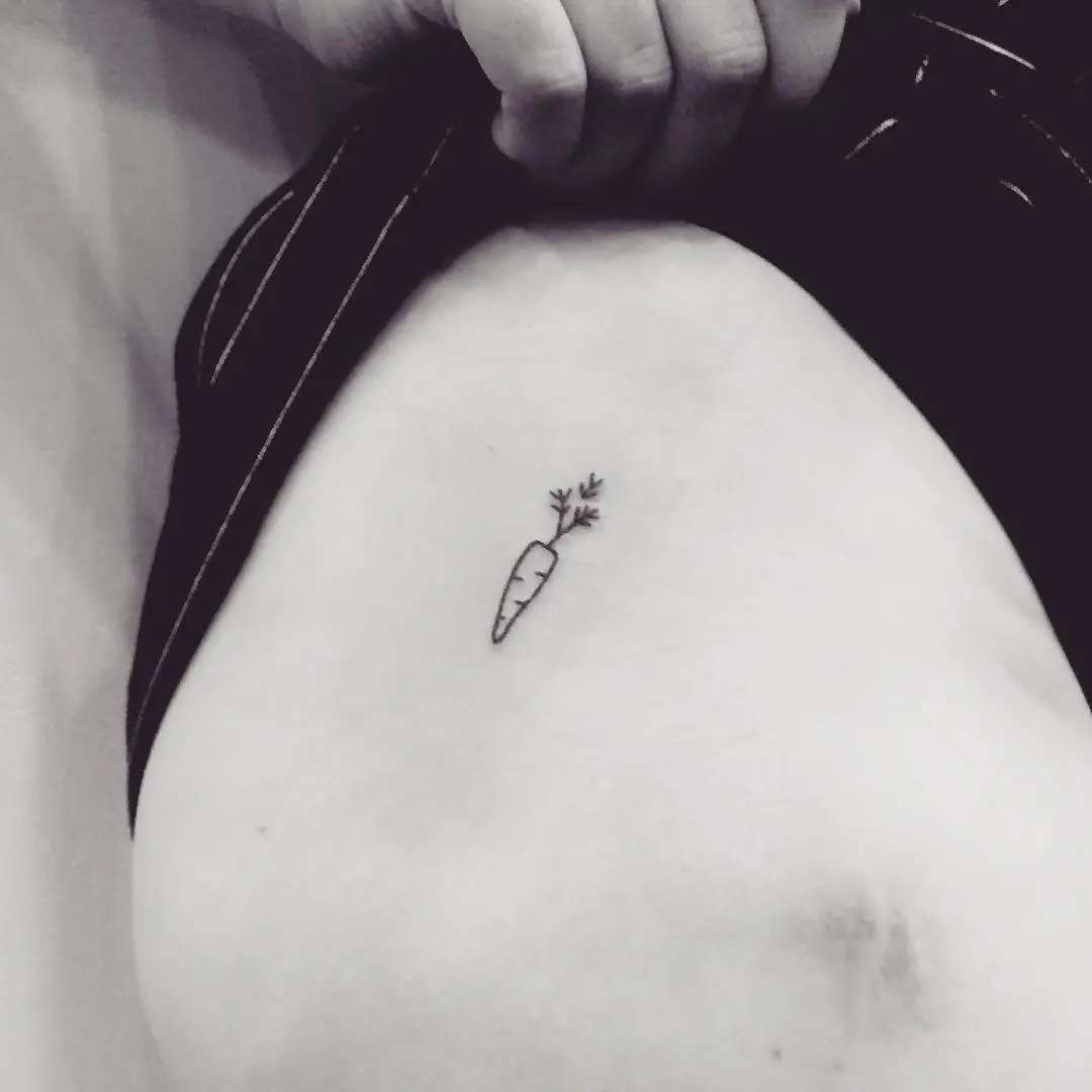 Charming minimalistic carrot tattoo design