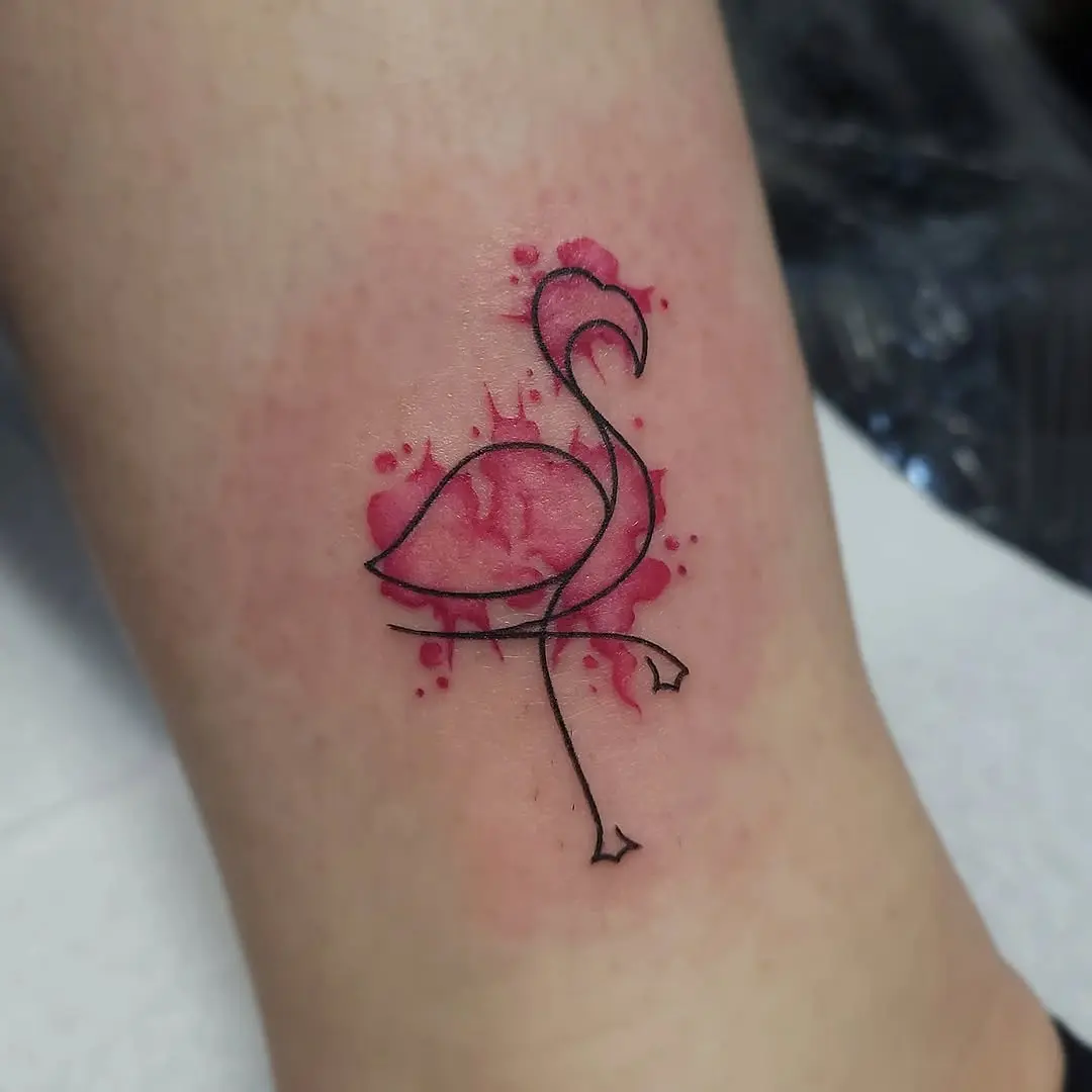 Elegant flamingo tattoo with watercolor splashes