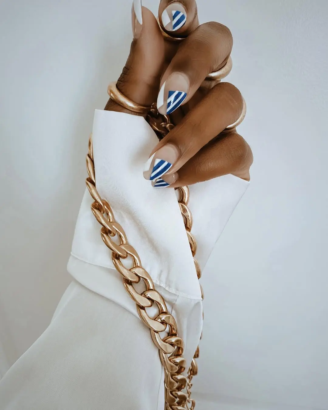 Chic nautical nails with bold stripe design