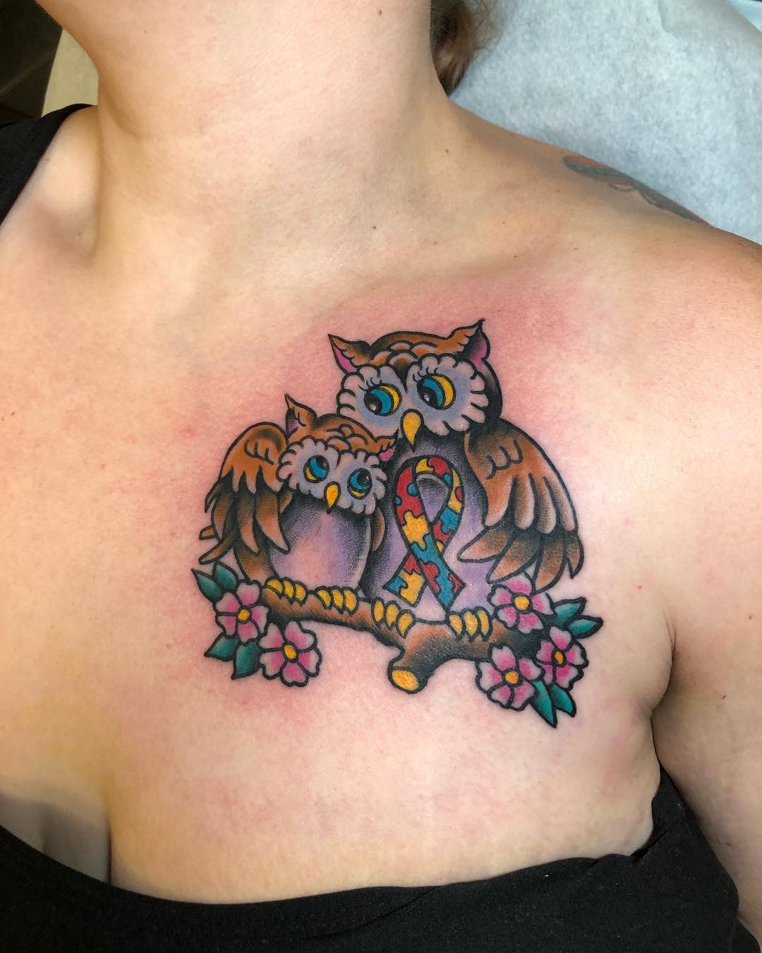 Whimsical owls highlighting autism awareness ribbon