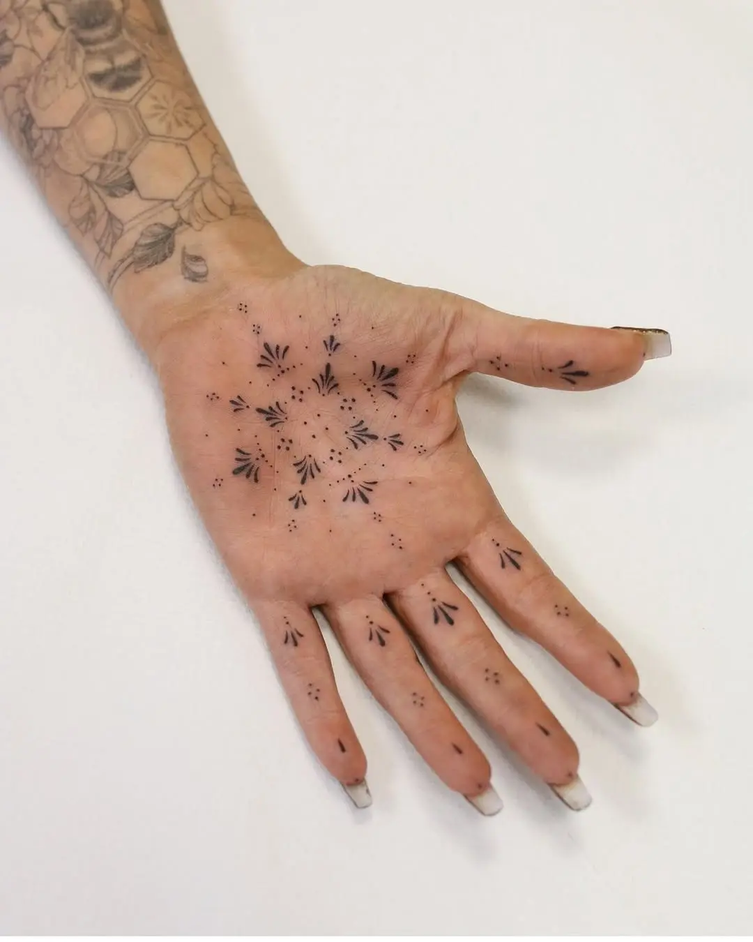 Unique palm tattoos with abstract designs
