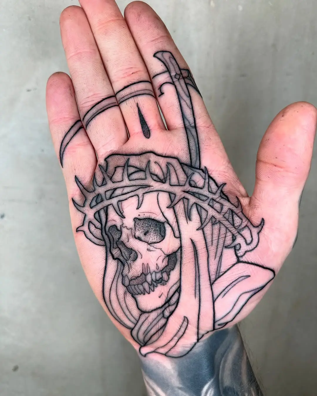 Intricate skull design with a sword detail