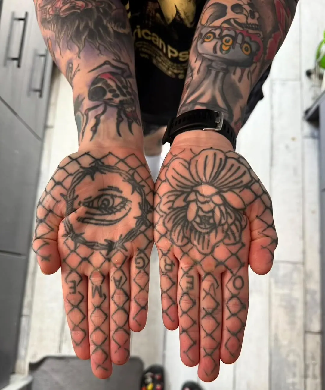 Bold palm tattoos with intricate designs