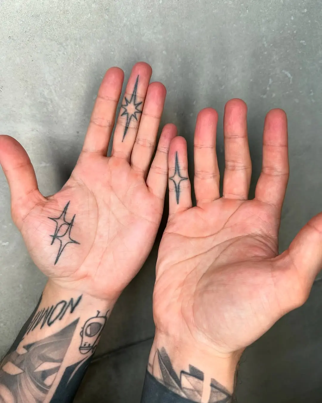Unique black ink palm tattoo designs showcased