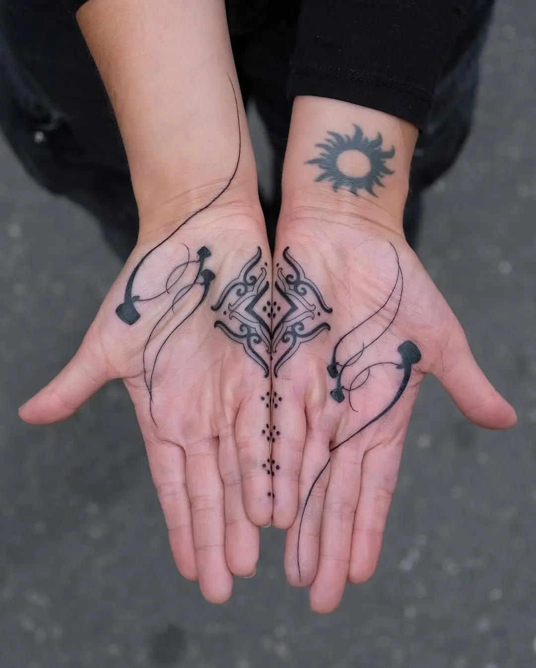 Intricate palm tattoo designs with symmetry.