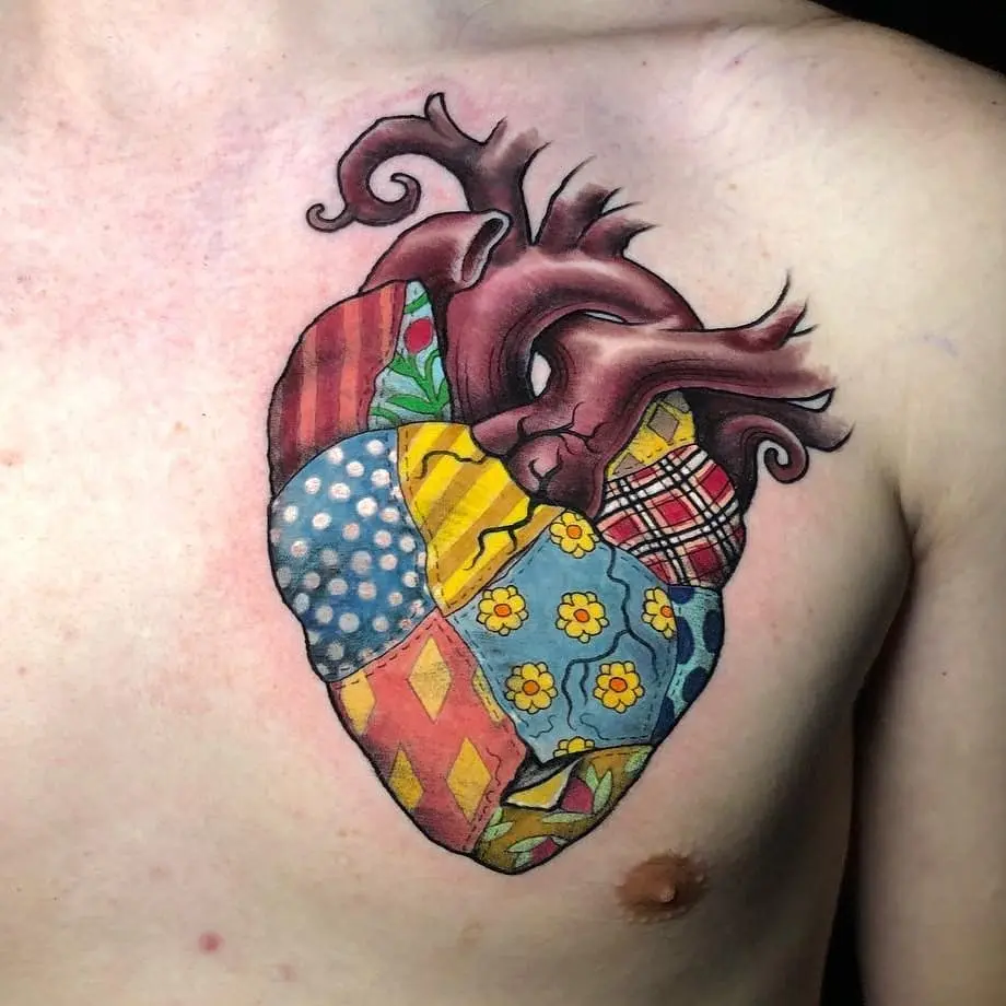 Vibrant quilted heart tattoo on chest
