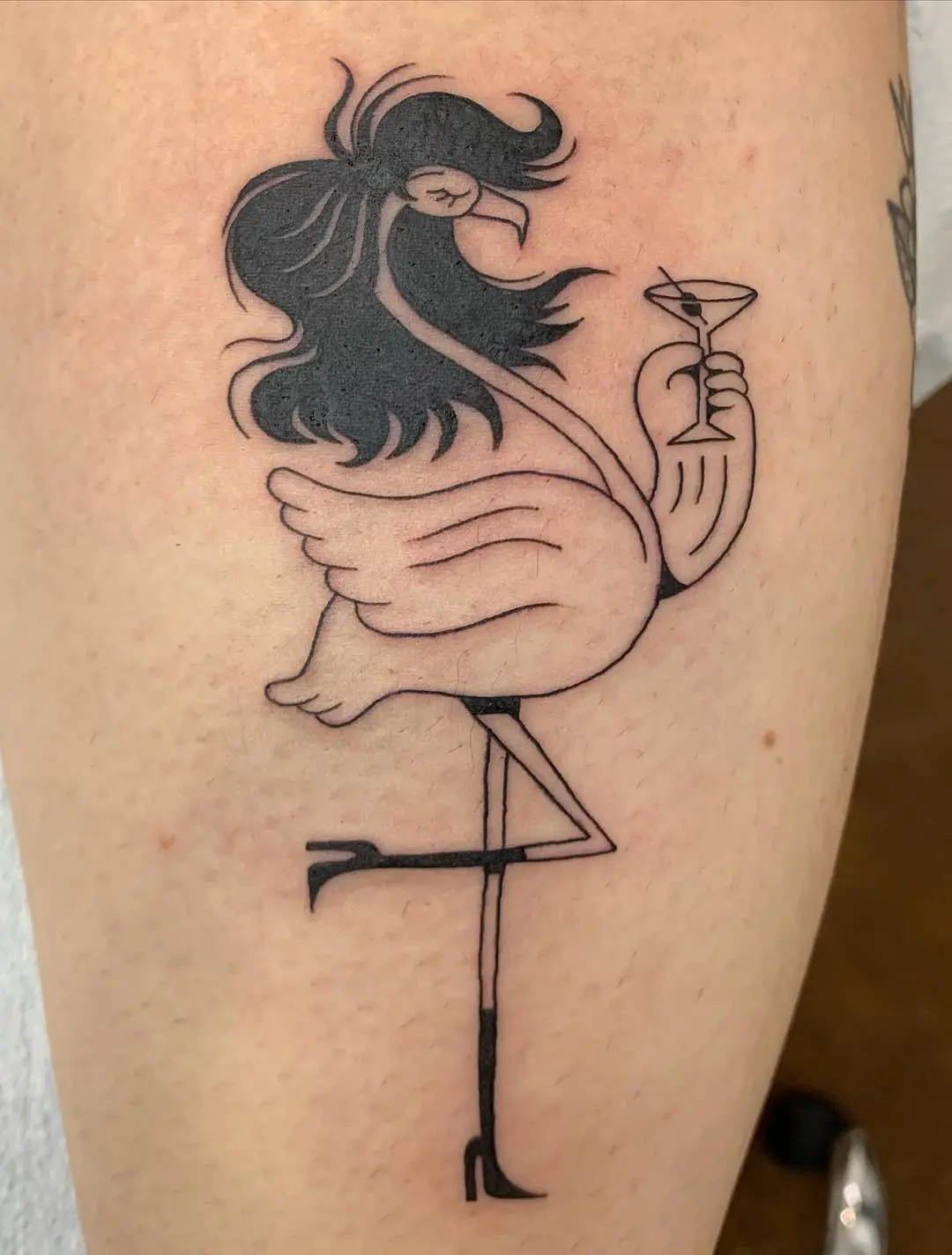 Whimsical flamingo tattoo with a chic twist