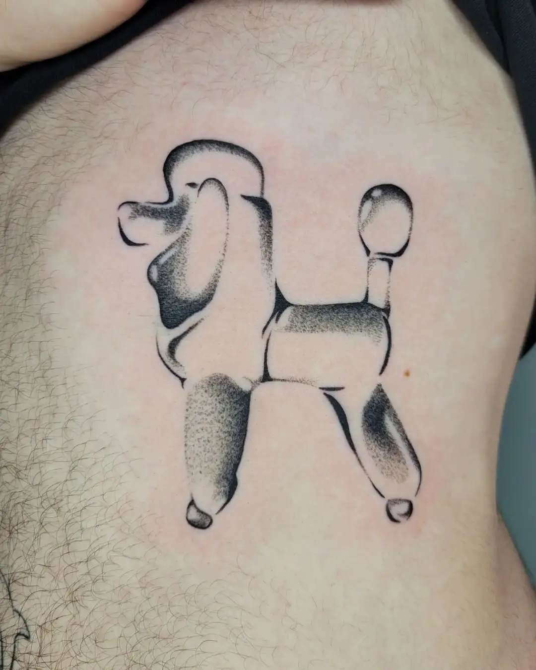 Playful poodle balloon animal tattoo design