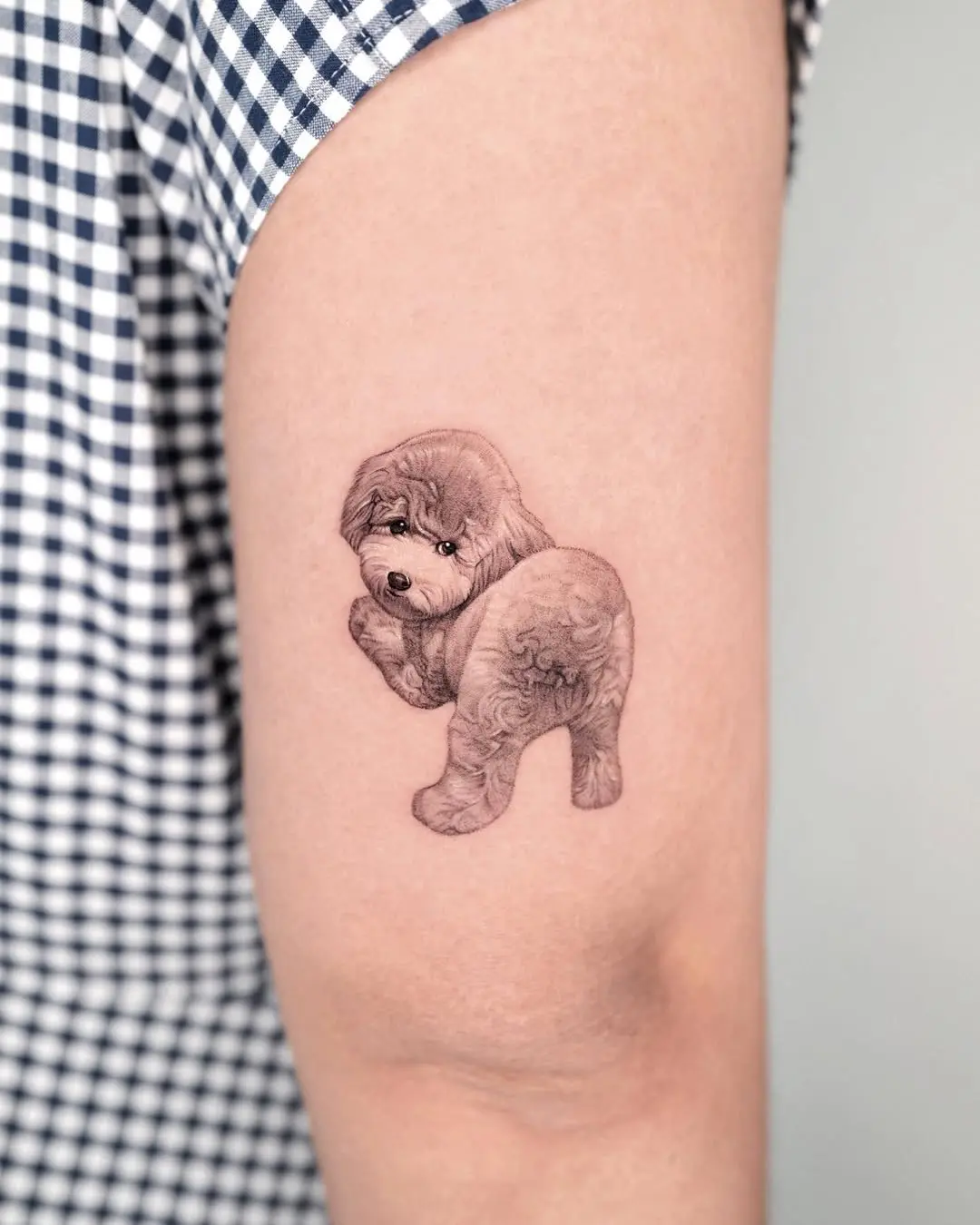 Cute poodle tattoo showcasing fluffy charm