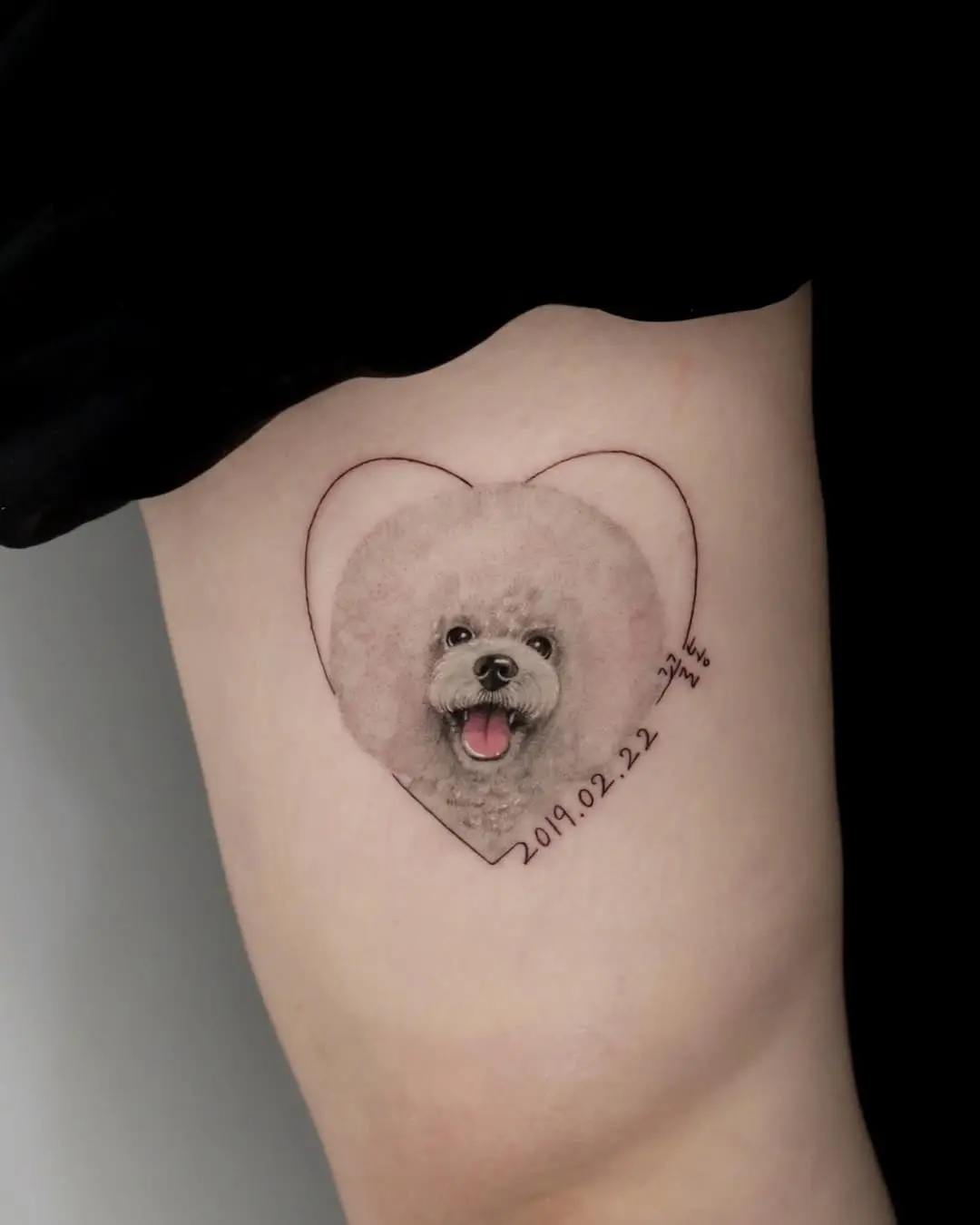 Charming poodle tattoo in heart framing