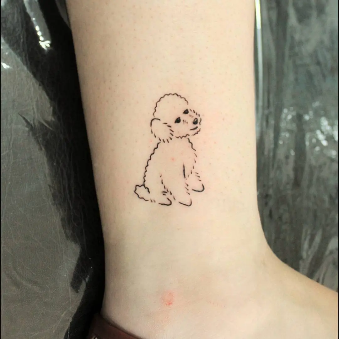 Charming poodle tattoo on the ankle