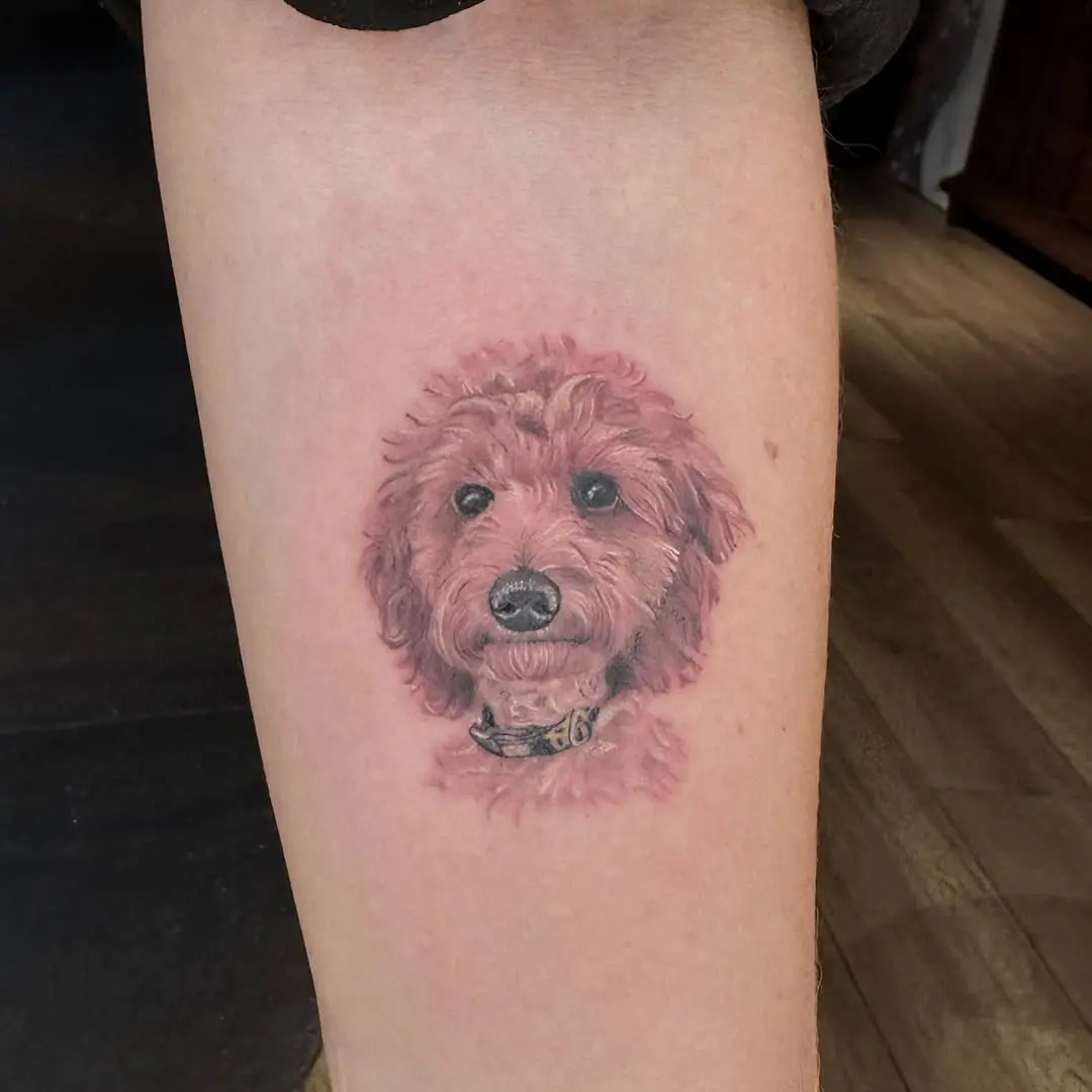 Charming poodle tattoo captures adorable canine essence