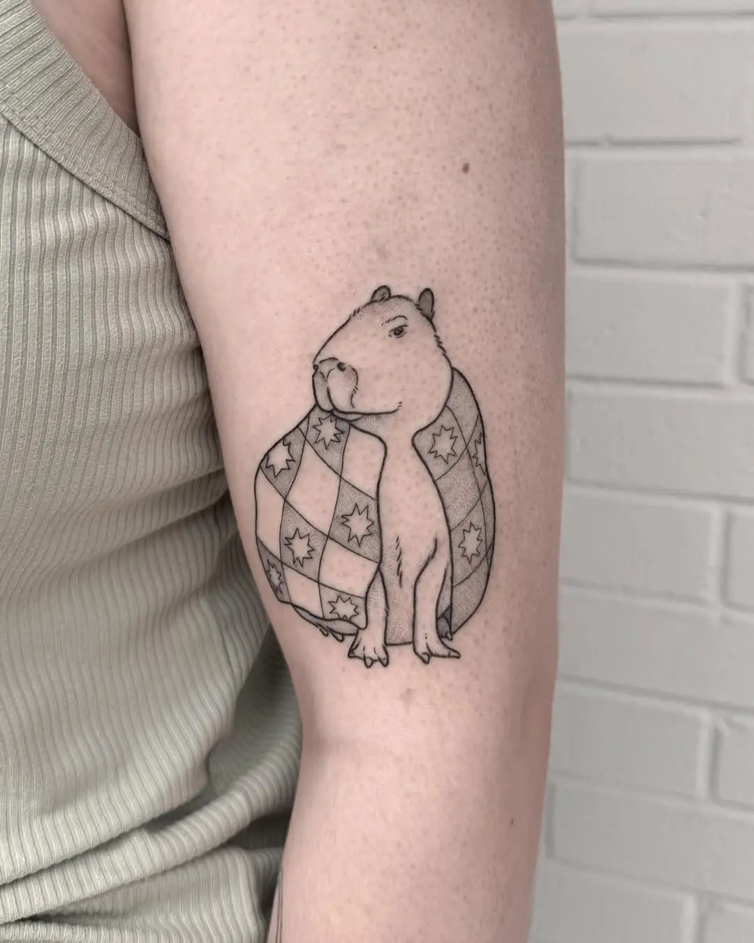 Charming Capybara Wrapped in Quilt Tattoo