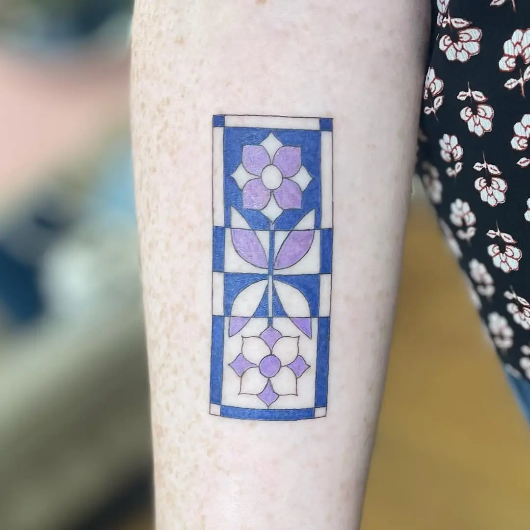Vibrant Quilt Tattoo with Floral Elements
