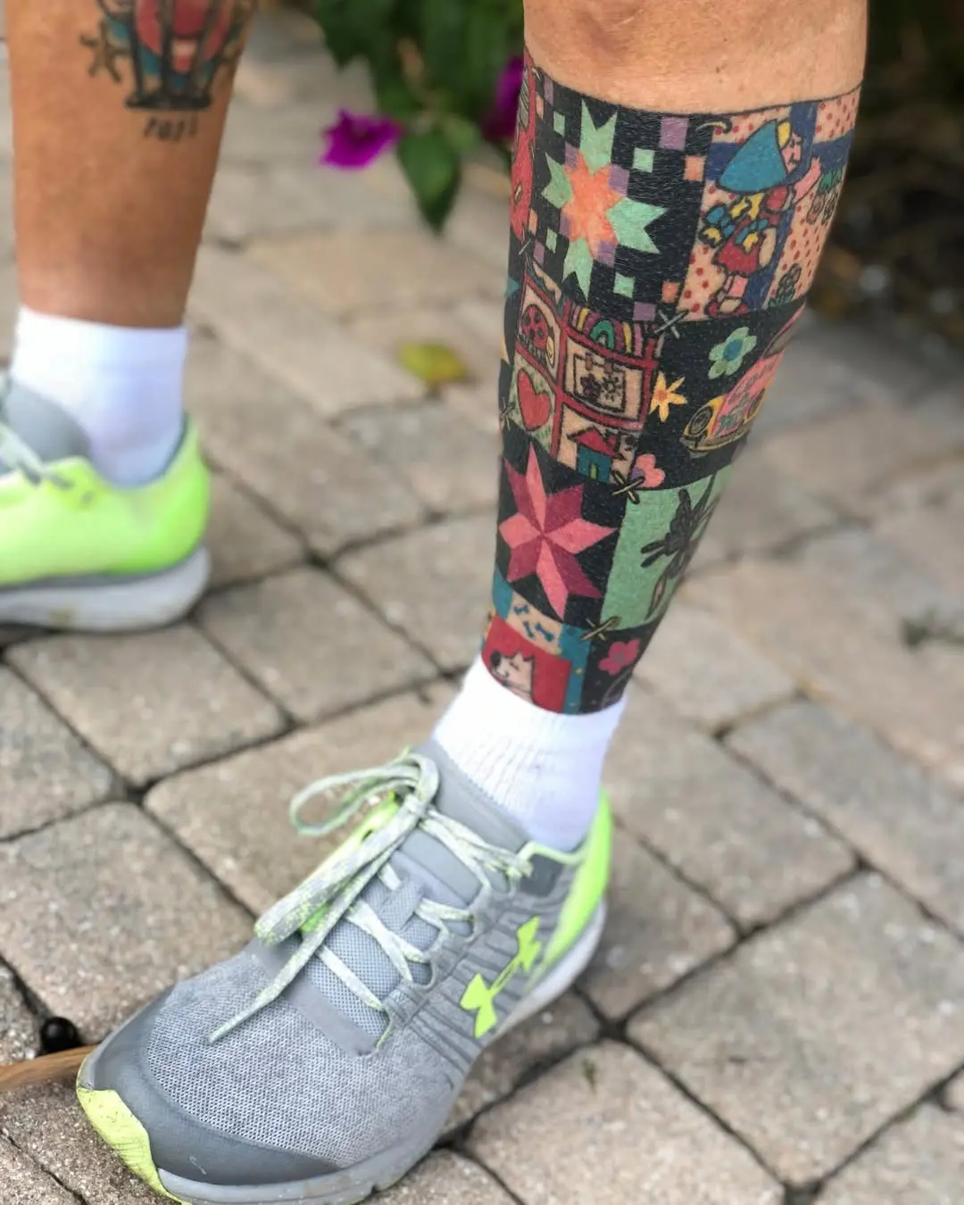 Vibrant quilt tattoo on a leg for expression