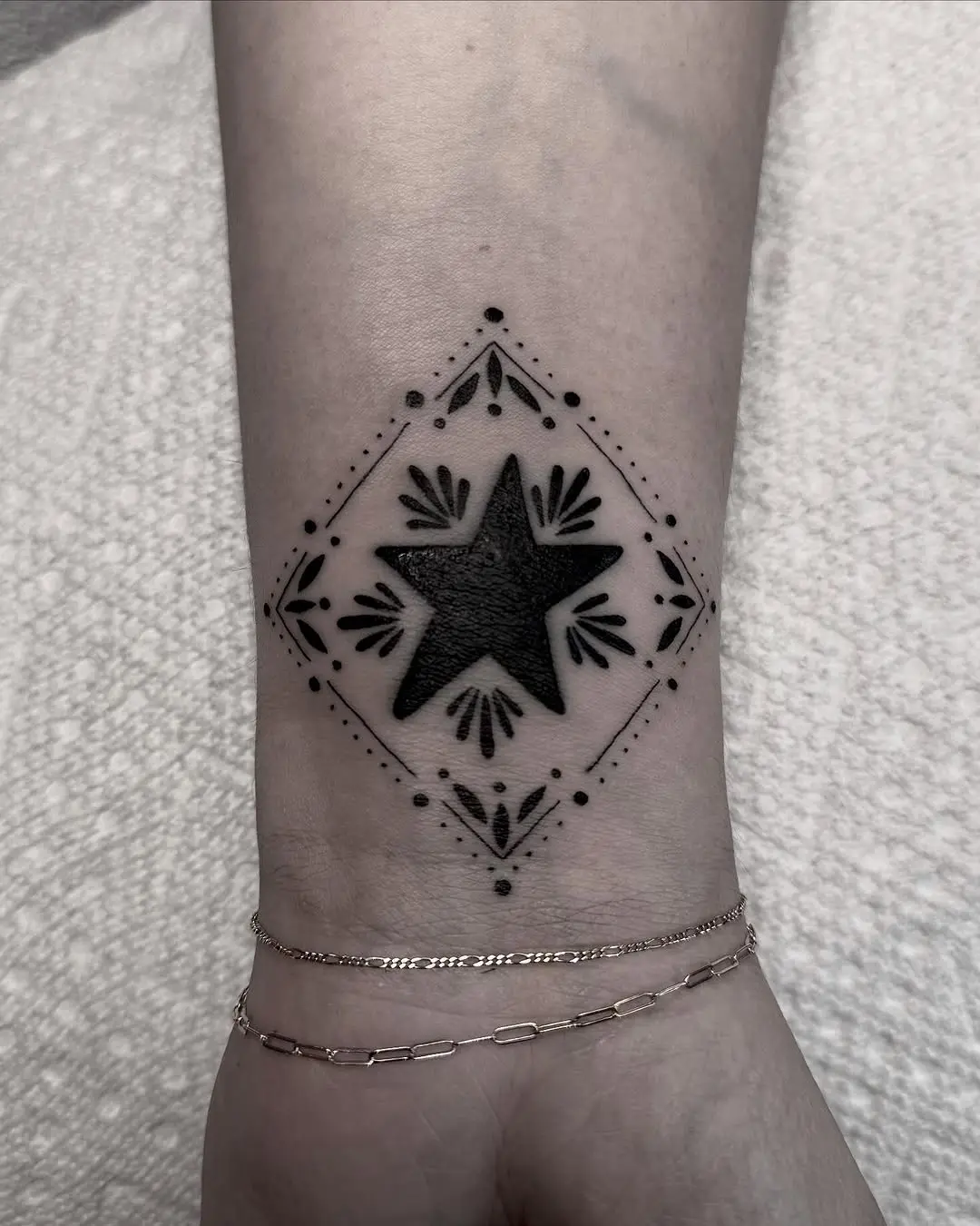 Chic star quilt tattoo with delicate details