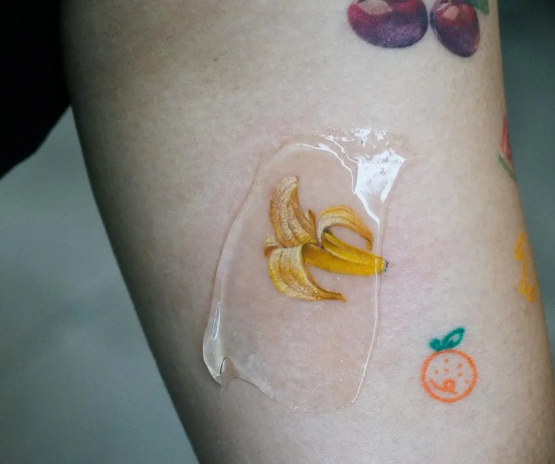 Vibrant banana tattoo with glossy finish