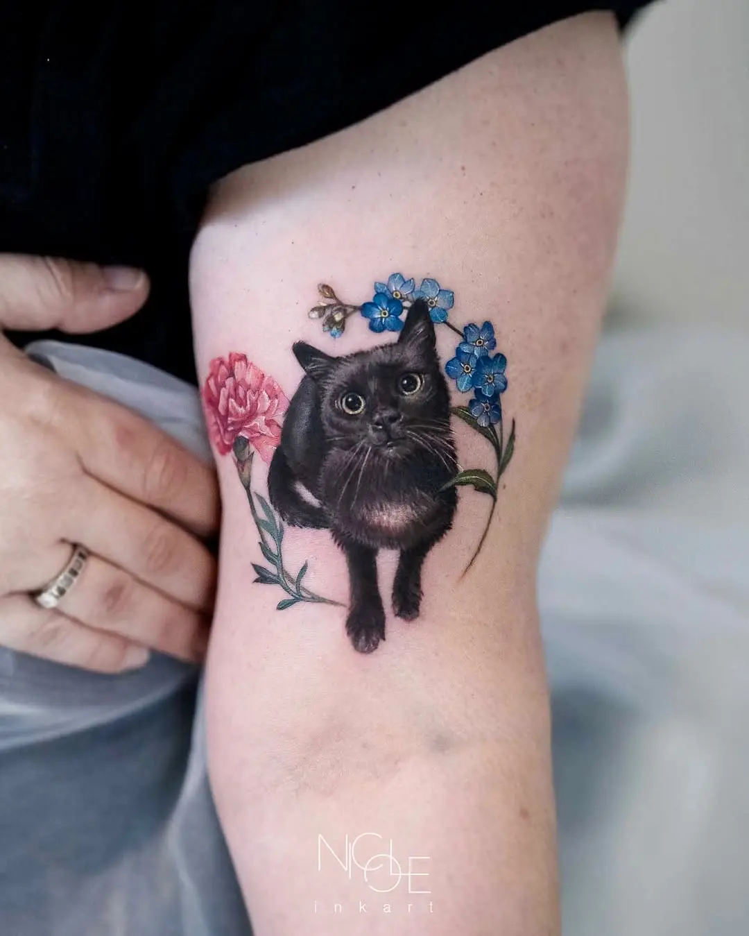 Charming realistic black cat with floral accents