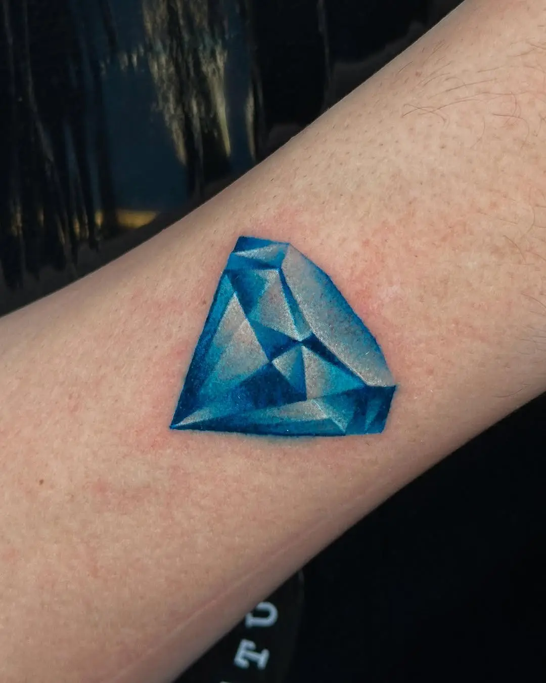 A Stunning Realistic Blue Diamond Tattoo