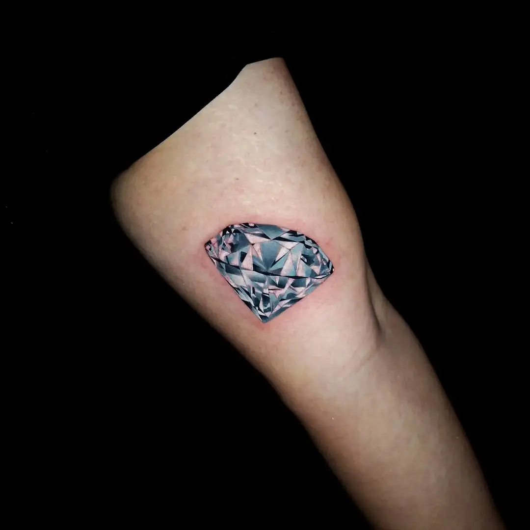Stunning diamond tattoo on the elbow