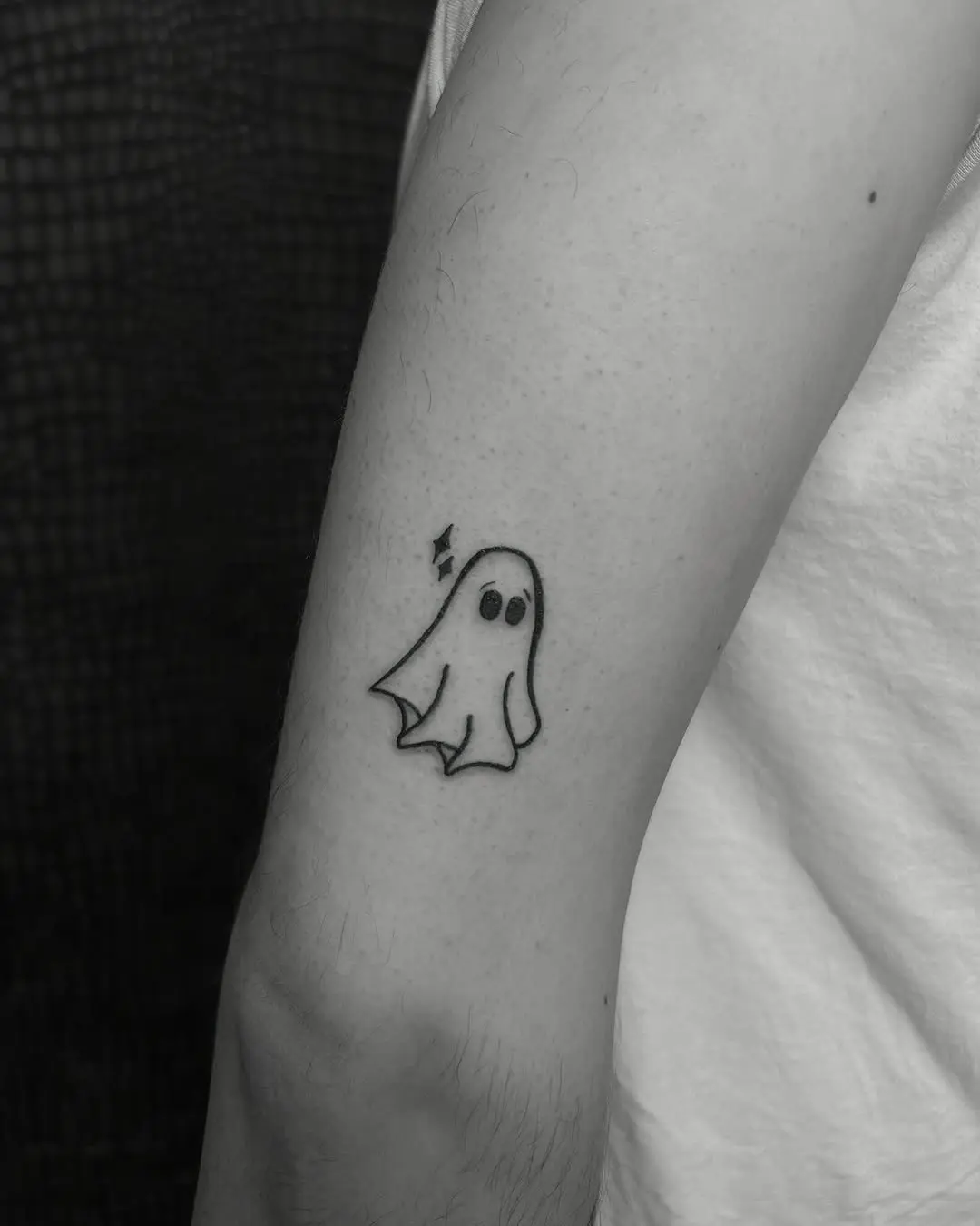Charming minimalistic ghost tattoo design