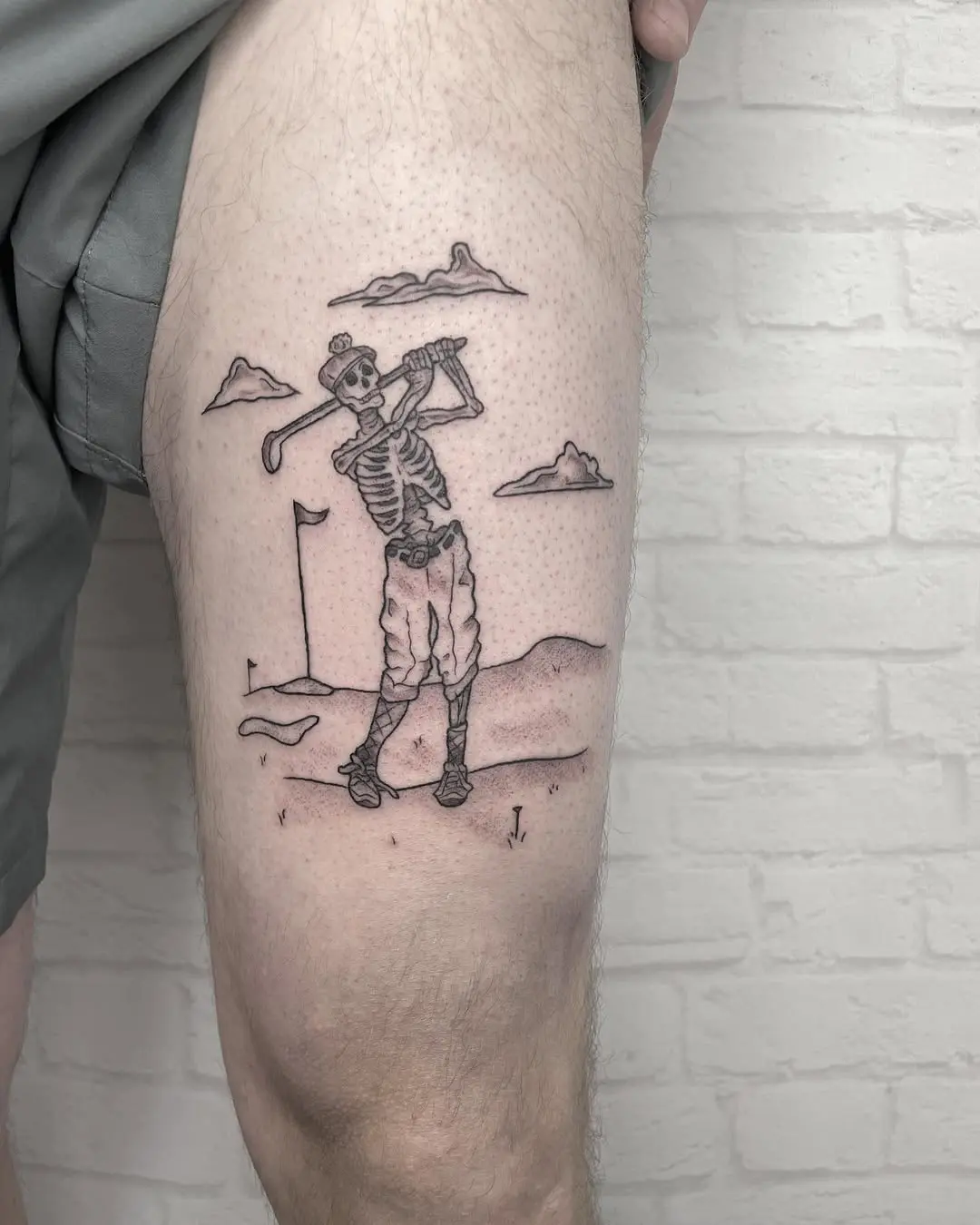 Unique skeleton golfer tattoo adds playful vibe