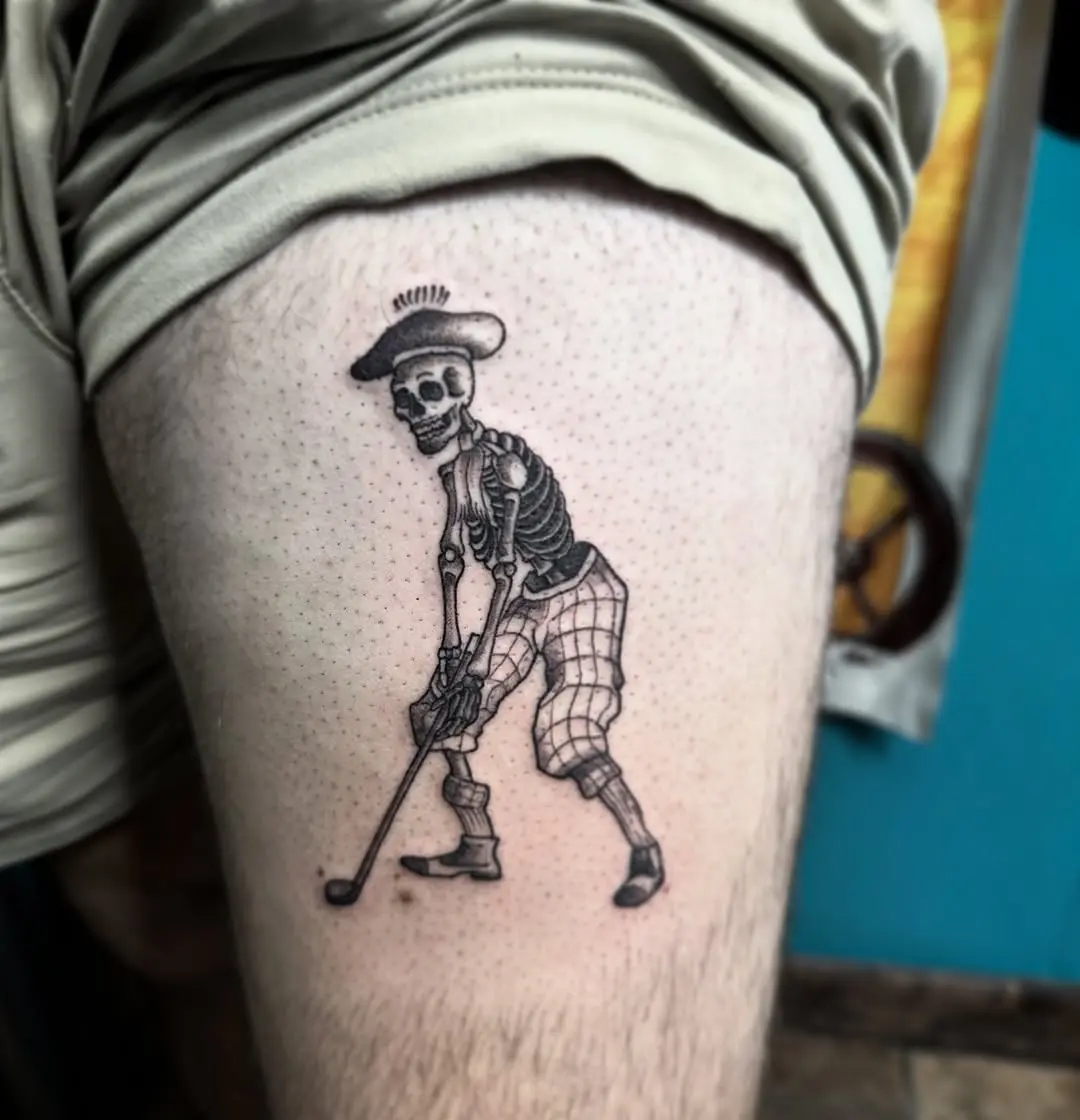 Unique skeleton golfer tattoo on thigh