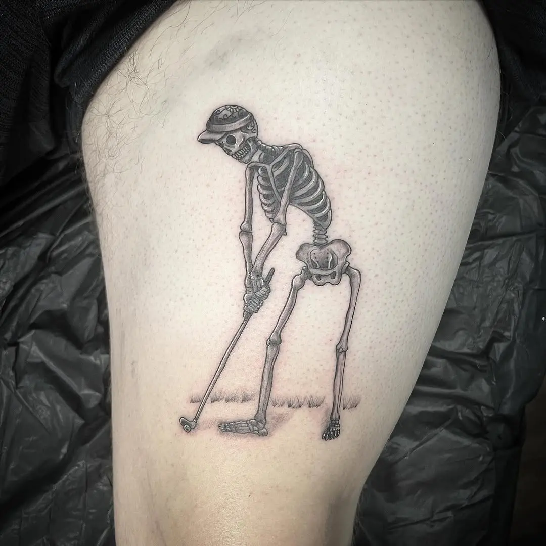 Creative skeleton golfer tattoo on leg