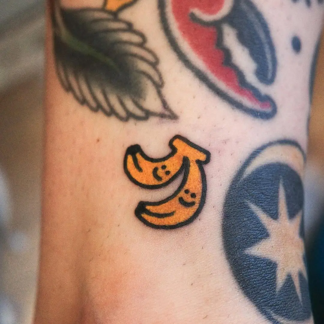 Playful Banana Tattoo with Cute Smiles