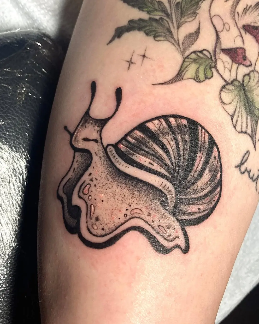 Charming snail tattoo with intricate details