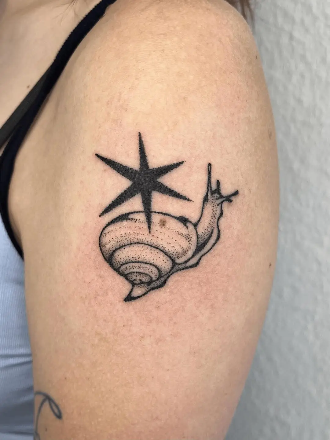 Unique Snail Tattoo with Star Accent