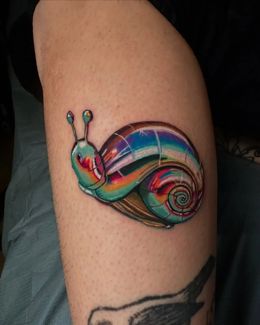 Vibrant Snail Tattoo with Iridescent Colors