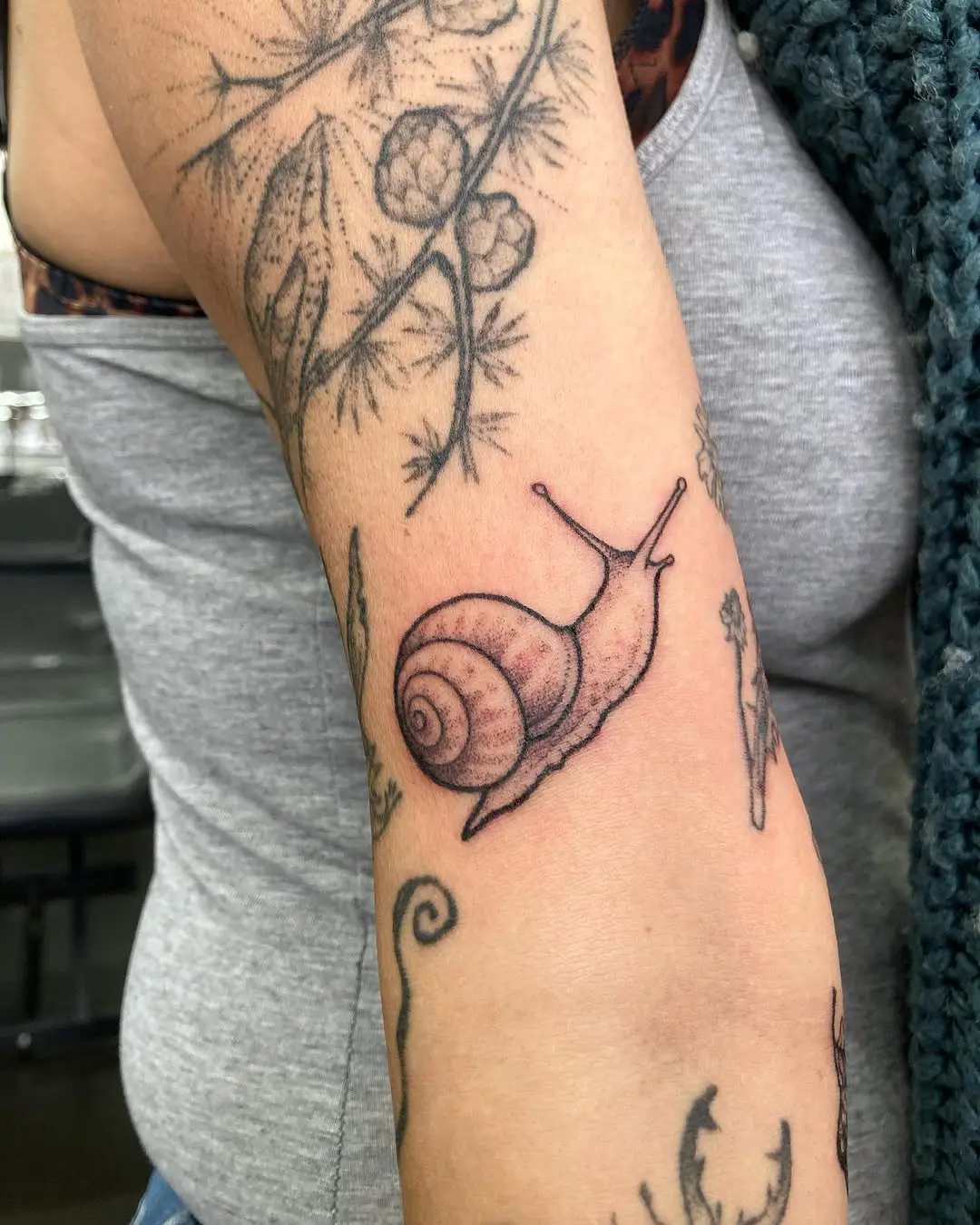 Charming Minimalist Snail Tattoo Design