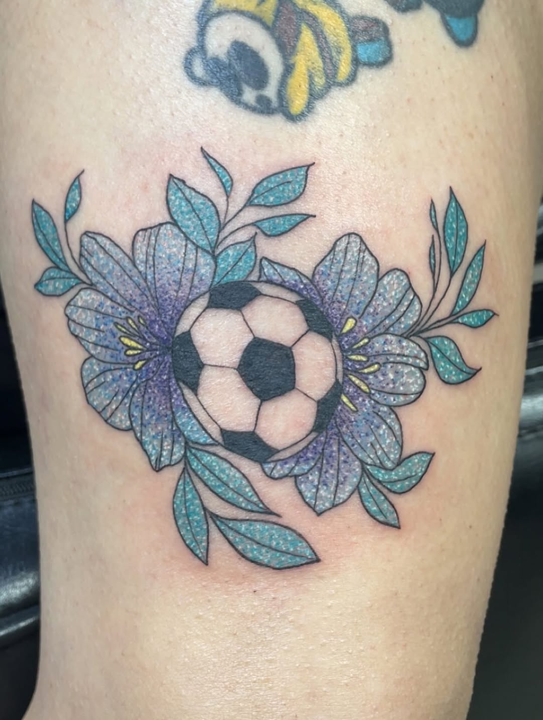 Soccer ball flower tattoo design with beauty