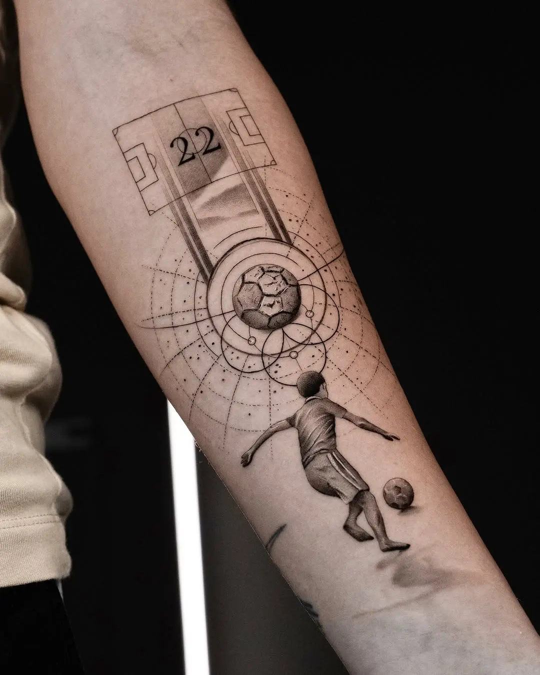 Elegant soccer tattoo showcasing dynamic movement