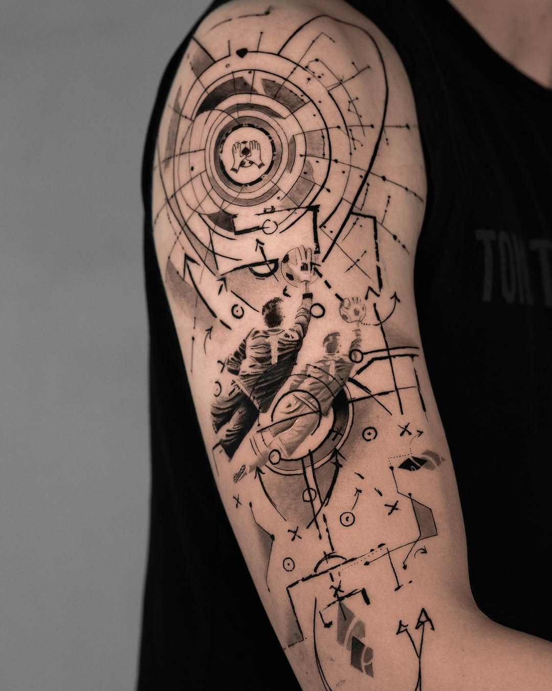 Dynamic soccer-themed tattoo with intricate designs
