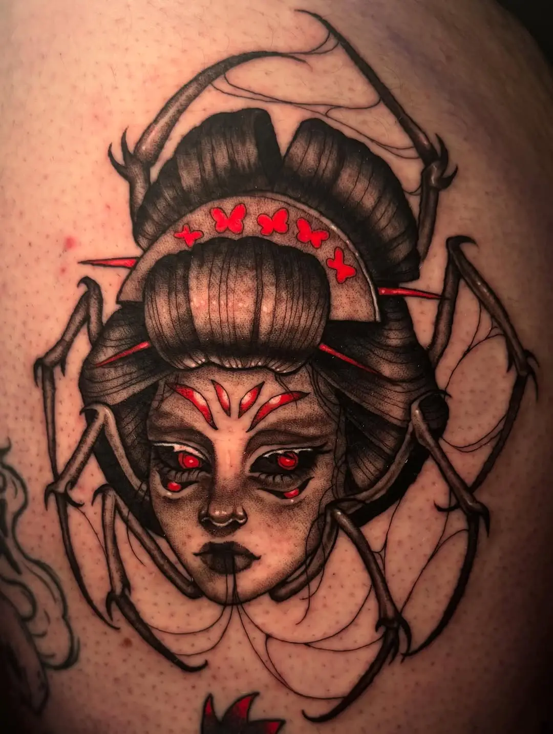 Elegant spider tattoo merging beauty and eeriness
