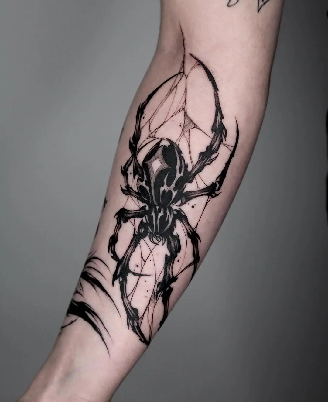 Intricate black ink spider tattoo design
