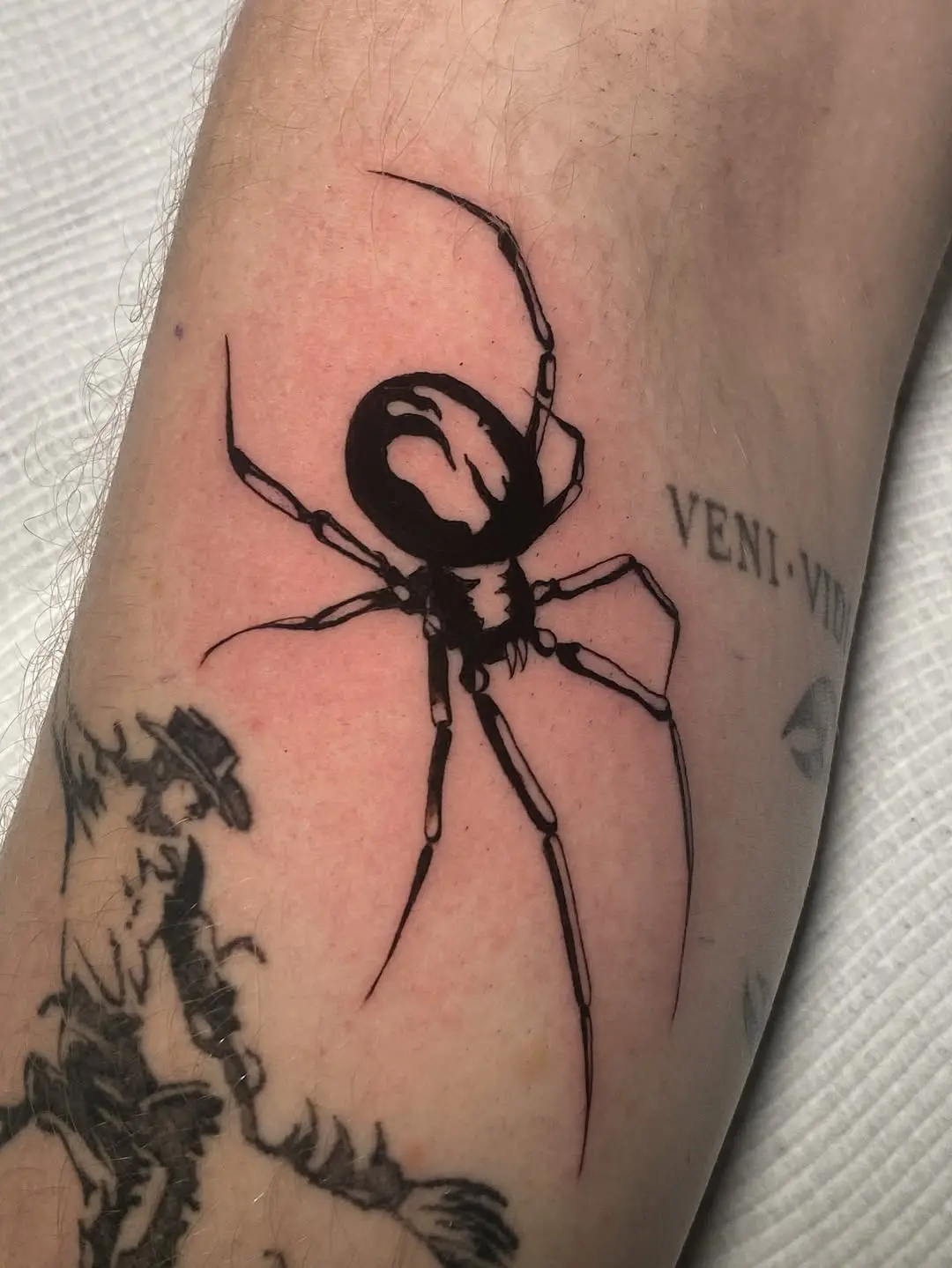 Striking blackwork spider tattoo design