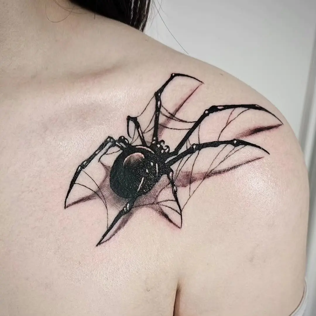 Realistic spider tattoo on the shoulder