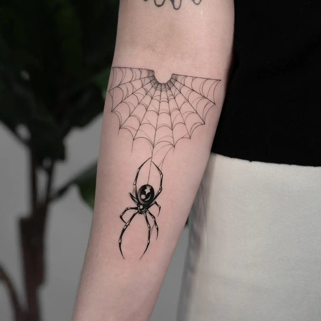 Intricate spider web tattoo with striking detail