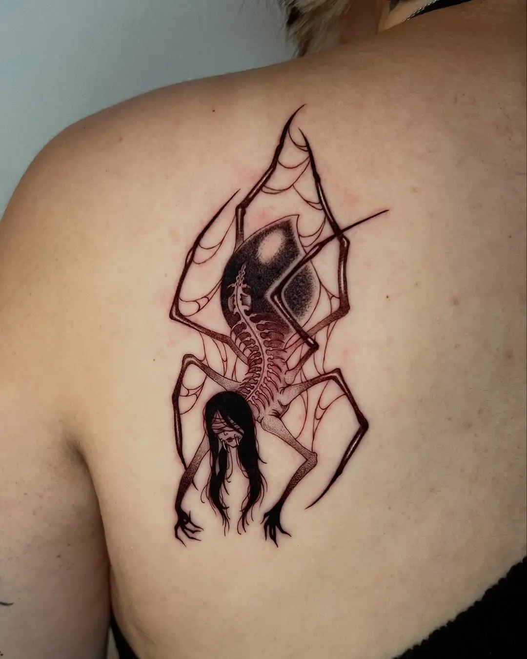 Eerie Spider Woman Tattoo on Back