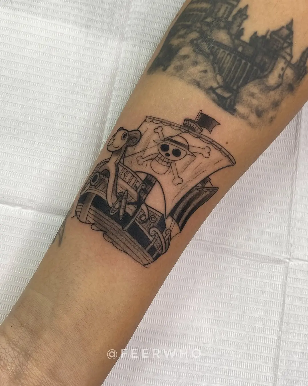 Unique squid tattoo featuring a pirate ship