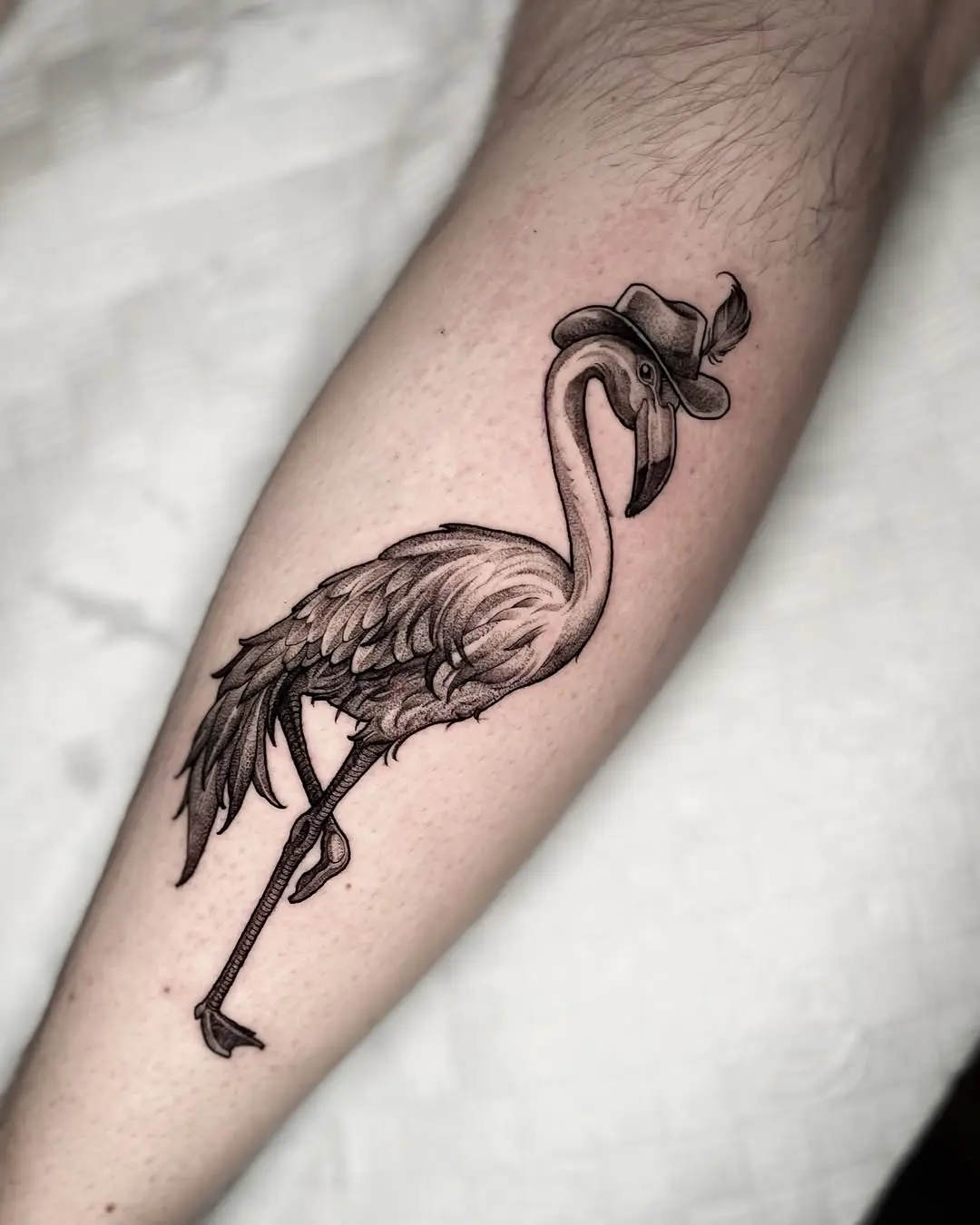Chic flamingo tattoo with a fashionable twist