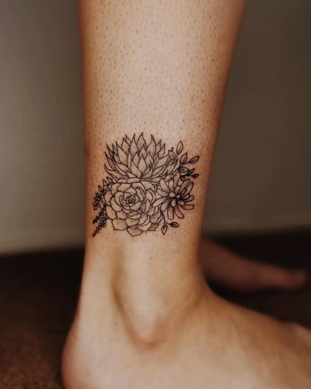 Elegant minimalist succulent tattoo on ankle