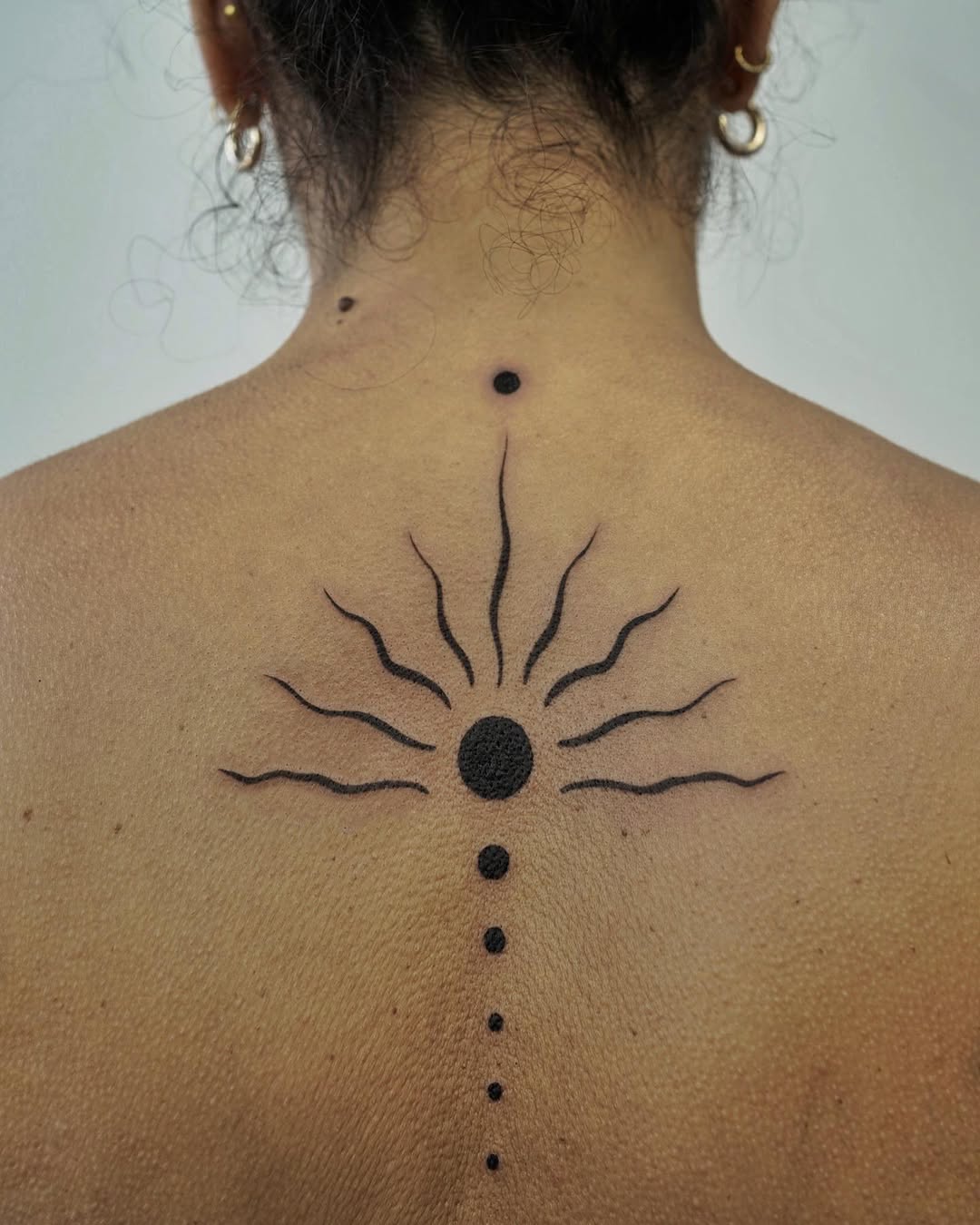 Stunning Sunrise Tattoo on Bare Skin