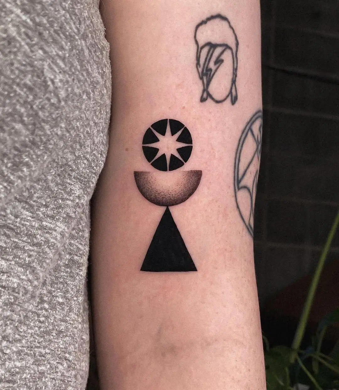 Geometric sunrise tattoo with captivating designs